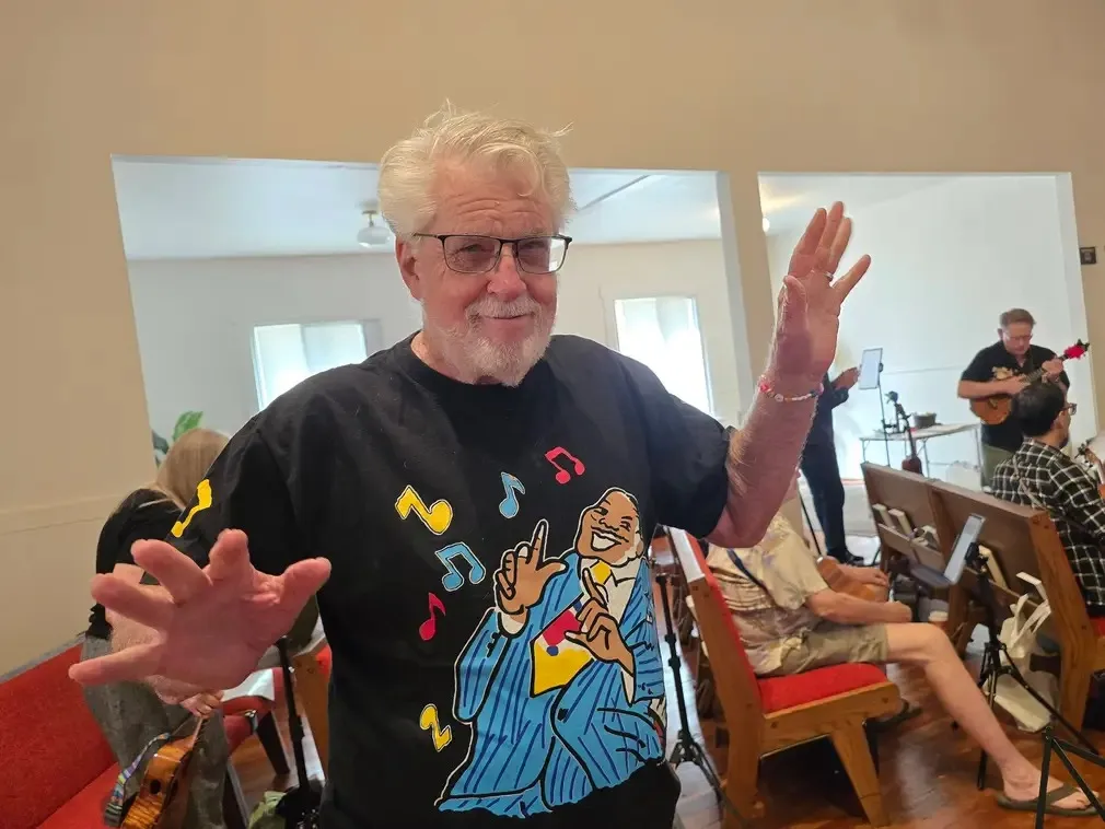 A player with arms out, counting the room in