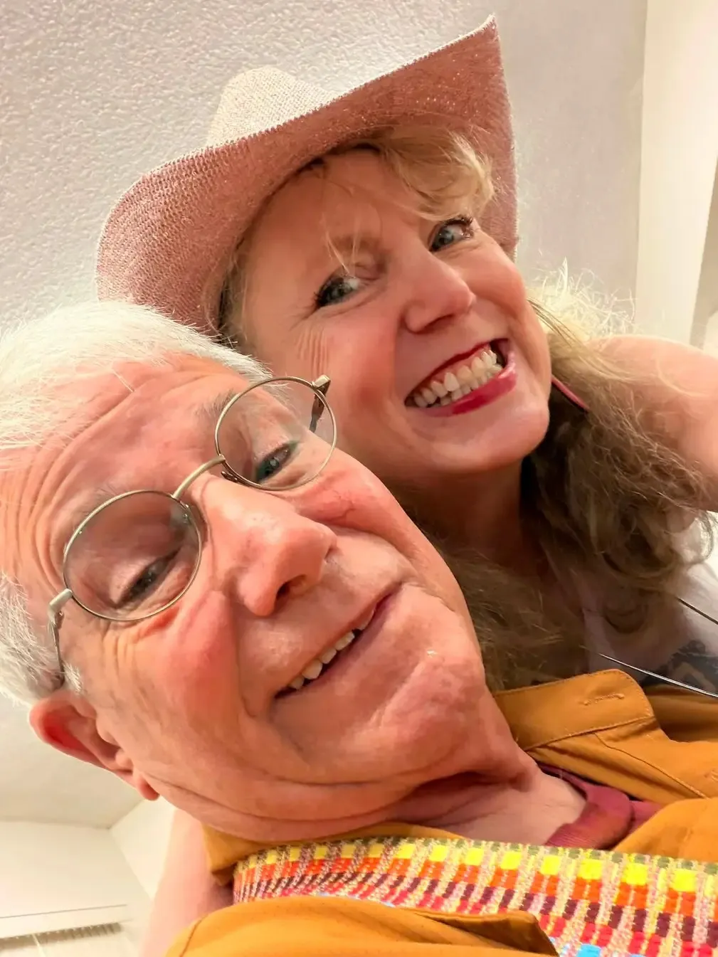 A close selfie of two players at the front of the hall