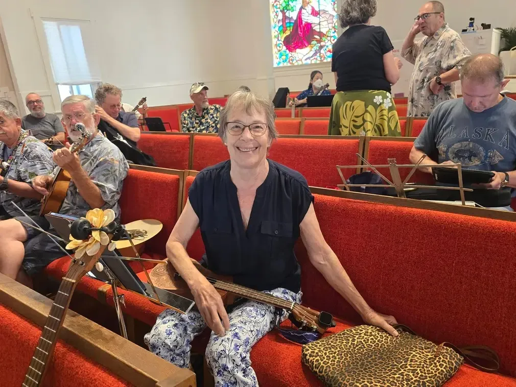 A player settling into the pews before the first song