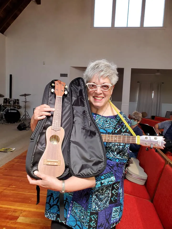 A loaner ukulele coming out of its case